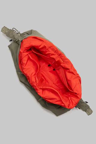Topologie Cloud hobo bag, red interior lining visible, zipper tab and strap loops