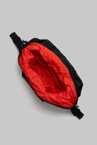 Topologie Cloud Hobo bag small, black exterior with red-lined interior and zipper pull