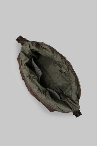 Small hobo bag interior view with fabric lining and zippered opening