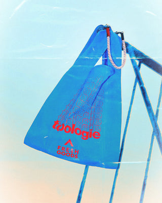 Atomic blue Topologie Konbini bag with red logo print and side gusset