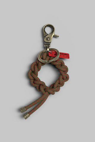 Red ivy lattice wreath keychain with metal clip and braided ribbon loop