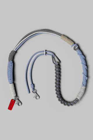 Topologie macrame strap in blue, gray, and beige braided cord with metal clips