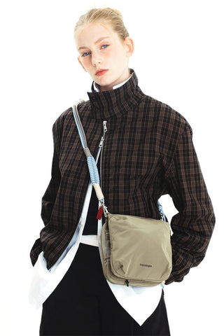 Topologie macrame strap in chambray, worn with a crossbody bag