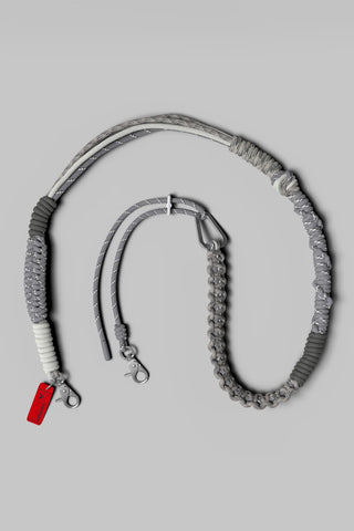 Topologie macrame strap in gray, with adjustable cord and metal clips.