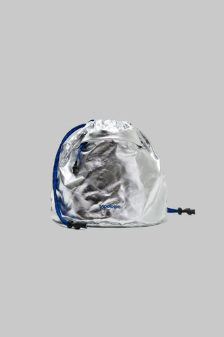 Topologie reversible bucket bag with metallic silver exterior and blue drawstring