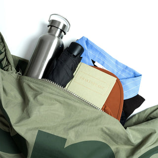 Topologie Robo bag open with zipper; holds water bottle and stacked accessories