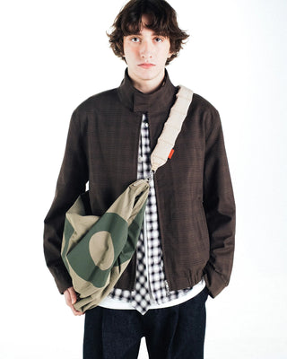 Topologie Robo bag worn at front, moss green nylon with beige circle graphic