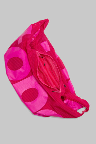 Topologie Robo bag close-up in bright pink translucent ripstop, front zipper and adjustable strap