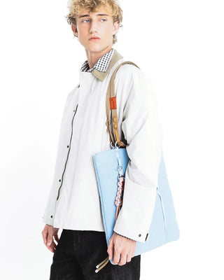 Topologie Sinnet keychain with braided cord, orange tag and metal clip on blue pouch