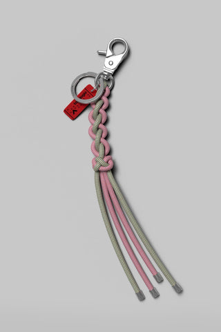 Red heart charm keychain with metal clip and braided pink/gray cords