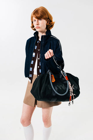 Black medium duffle bag with top handles and hanging keychain clips