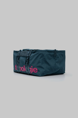Deep teal medium duffle bag with rolled top handles and front logo print