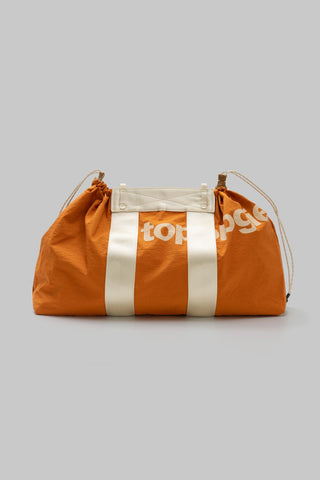 Orange and white striped duffel-style tote with drawstring closure and top carry handles.