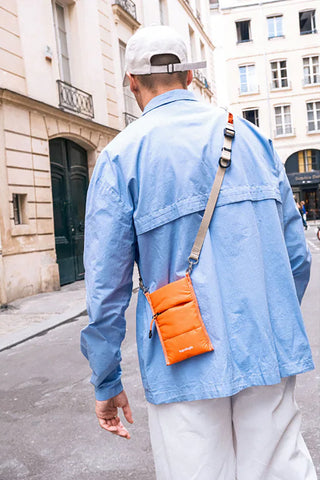 Small utility sling crossbody bag with adjustable strap, orange fabric pouch