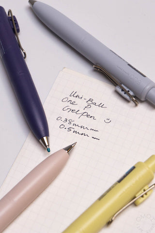 Uni-Ball One P gel pens on grid paper, light gray and dark blue, 0.38 mm tips
