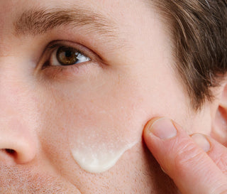 Vitamin C serum applied under eye and along cheek