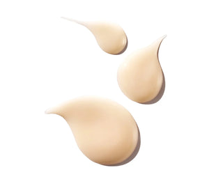 Beige gel swatches and drops for moisturizer texture on a clean surface