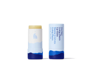 Lip balm tube and capped stick set with white body, blue mountains, yellow cap