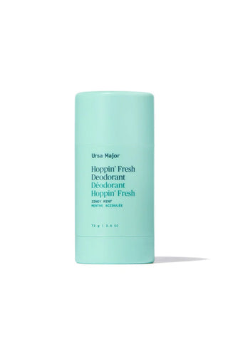 Mint teal deodorant stick in capped tube with printed product label.
