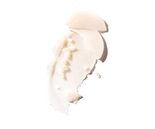 White deodorant paste spread on skin.