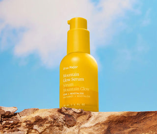 Yellow pump serum bottle standing upright
