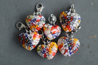 Heart-shaped millefiori glass charm set with silver metal loops
