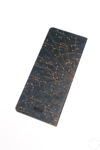 Star map notebook with dark navy cover and gold star chart print, angled view