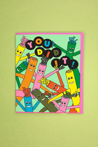 Colorful “YOU DID IT” greeting card with cartoon characters and bright confetti style design