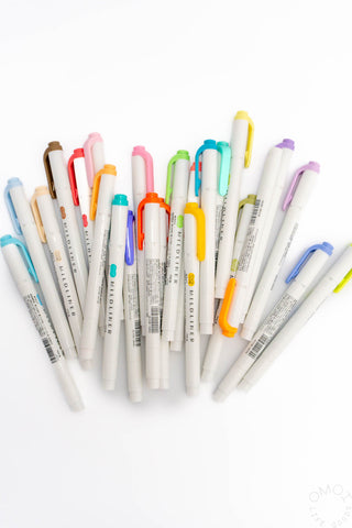 Assorted ZEBRA Mildliner highlighter pens, multiple colors with white barrels