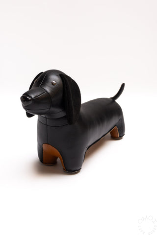 Black dachshund bookend figurine with floppy ears and shiny leather-look finish