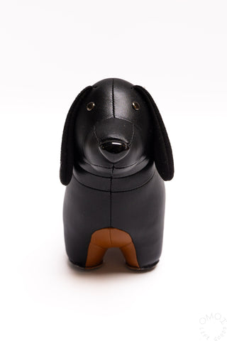 Black dachshund bookend figurine, front view with curved snout and dot eyes