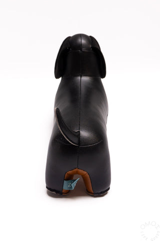 Black dachshund bookend figurine, rear view with tail and molded paws