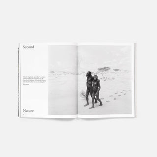 Open magazine spread with 'Second' and 'Nature' sections and monochrome outdoor photo
