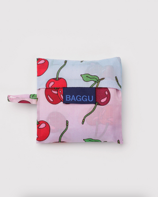 Folded Baby BAGGU cherry print pouch with BAGGU label, pastel fabric