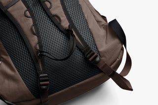 Brown daypack back panel with breathable mesh and adjustable shoulder straps