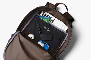 Brown daypack with front zip organizer pocket and internal compartments
