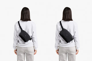 Dark gray crossbody sling bag with zip pocket, worn over shoulder