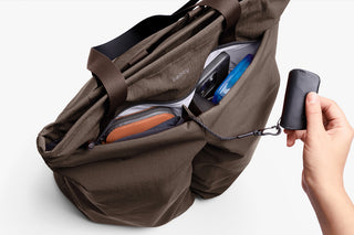Bellroy tote bag open with interior pockets and elastic straps; side zipper visible