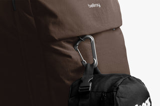 Bellroy travel backpack close-up of metal carabiner attachment and webbing