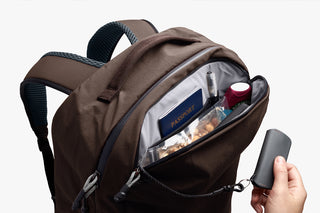 Bellroy travel backpack open top view showing inner pocket and small items
