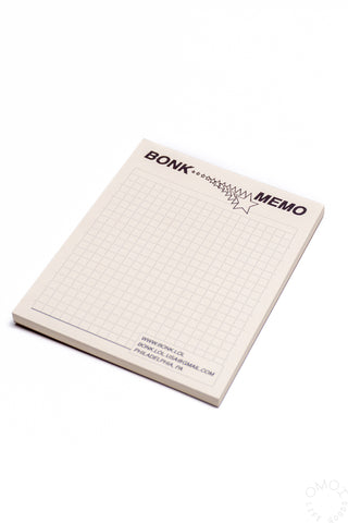 Beige grid memo pad with BONK MEMO header and star-style green outline accents