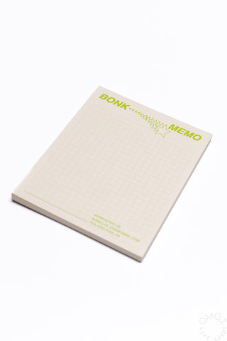 Green-accent grid memo pad with BONK MEMO header and squared writing area