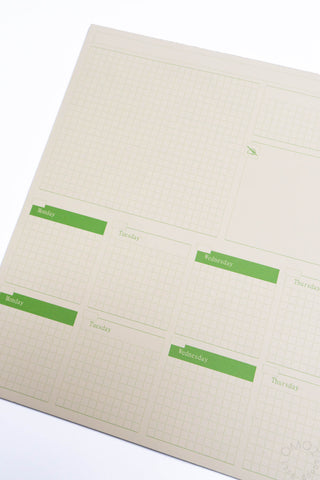 Two-week desk planner page with green timetable bars and day labels