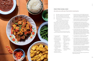 Cookbook open spread with plate of stir-fry, beans, and chili sauce bowls