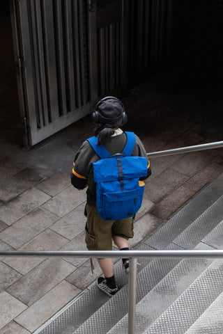 Bellroy indigo rolltop backpack seen from behind with padded straps