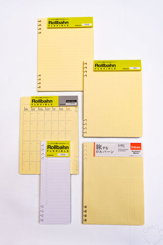 Cream Rollbahn refill pages set with spiral rings and ruled/grid sheet styles