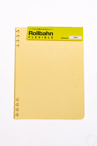 Cream grid refill sheet with spiral rings and textured graph background