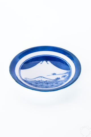 Blue mini ceramic plate with white border and mountain landscape artwork