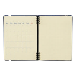 Cream refill pages opened flat with grid layout and black ring binding