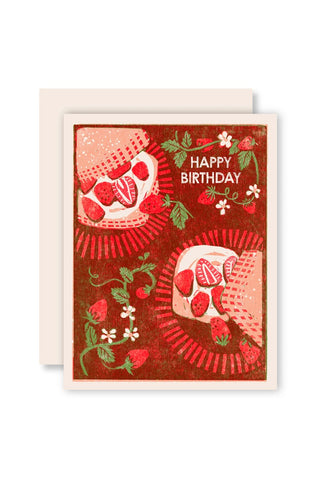 Birthday letterpress card with red strawberry pattern, green leaves and 'Happy Birthday' text.